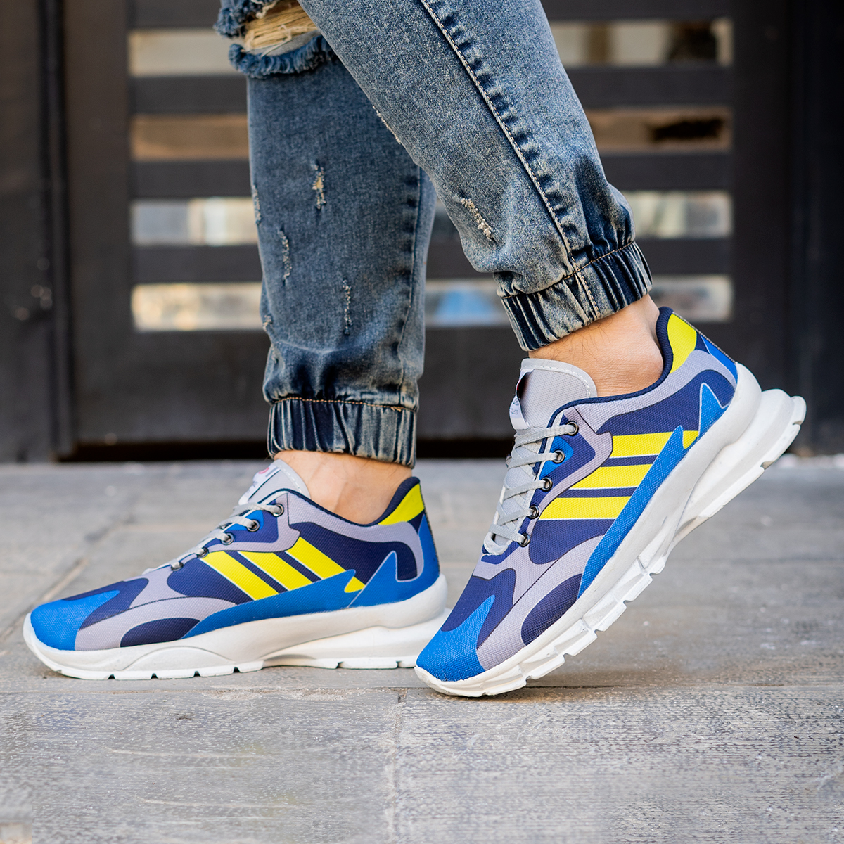 کفش ورزشی Adidas مردانه زرد آبی مدل Tacha