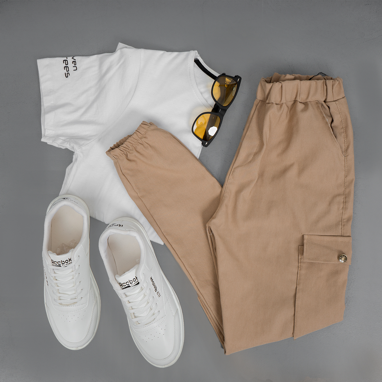 شلوار اسلش مردانه جیب دکمه ای کرم مدل baten